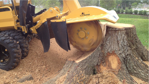 yellow stump grinder in action Greater London